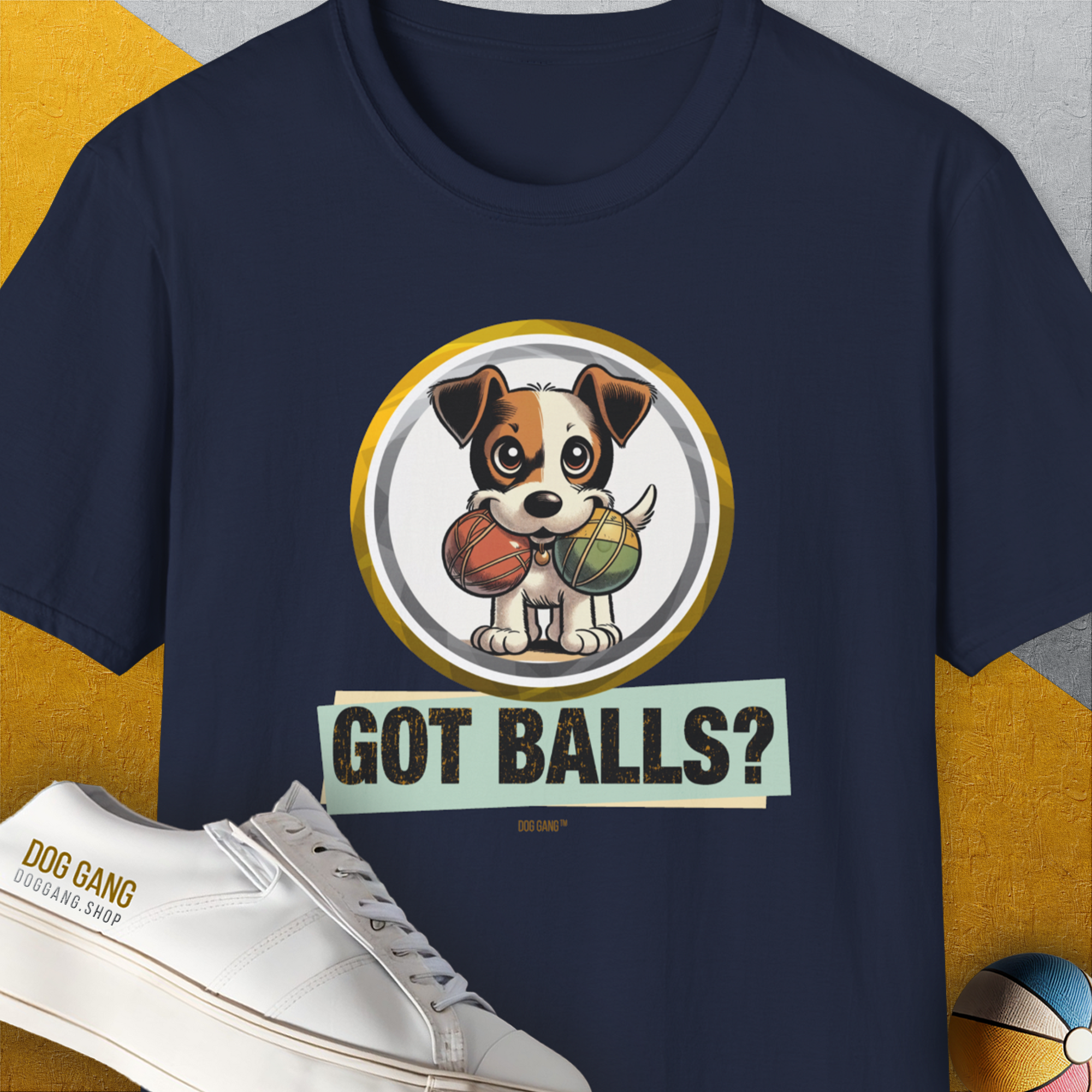 The T-shirt showcases a cartoon dog with 2 fetch balls and the playful quote, GOT BALLS? Perfect for any dog lover. Designed by Dog Gang.