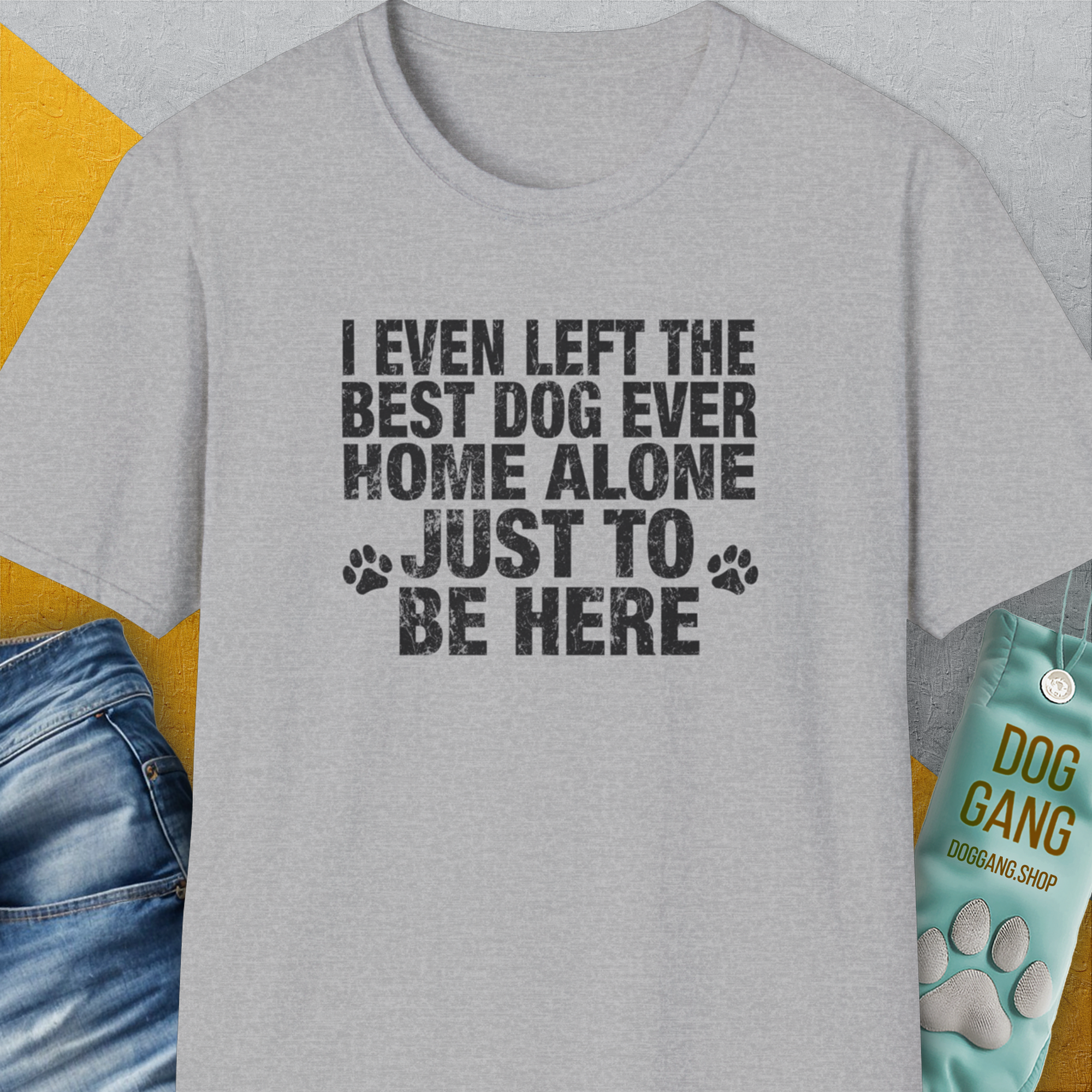 The unisex I Even Left The Best Dog Ever Home Alone Just To Be Here shirt in sport grey boasts a puppy print tee and text, crafted for stylish dog lovers. Designed by Dog Gang.