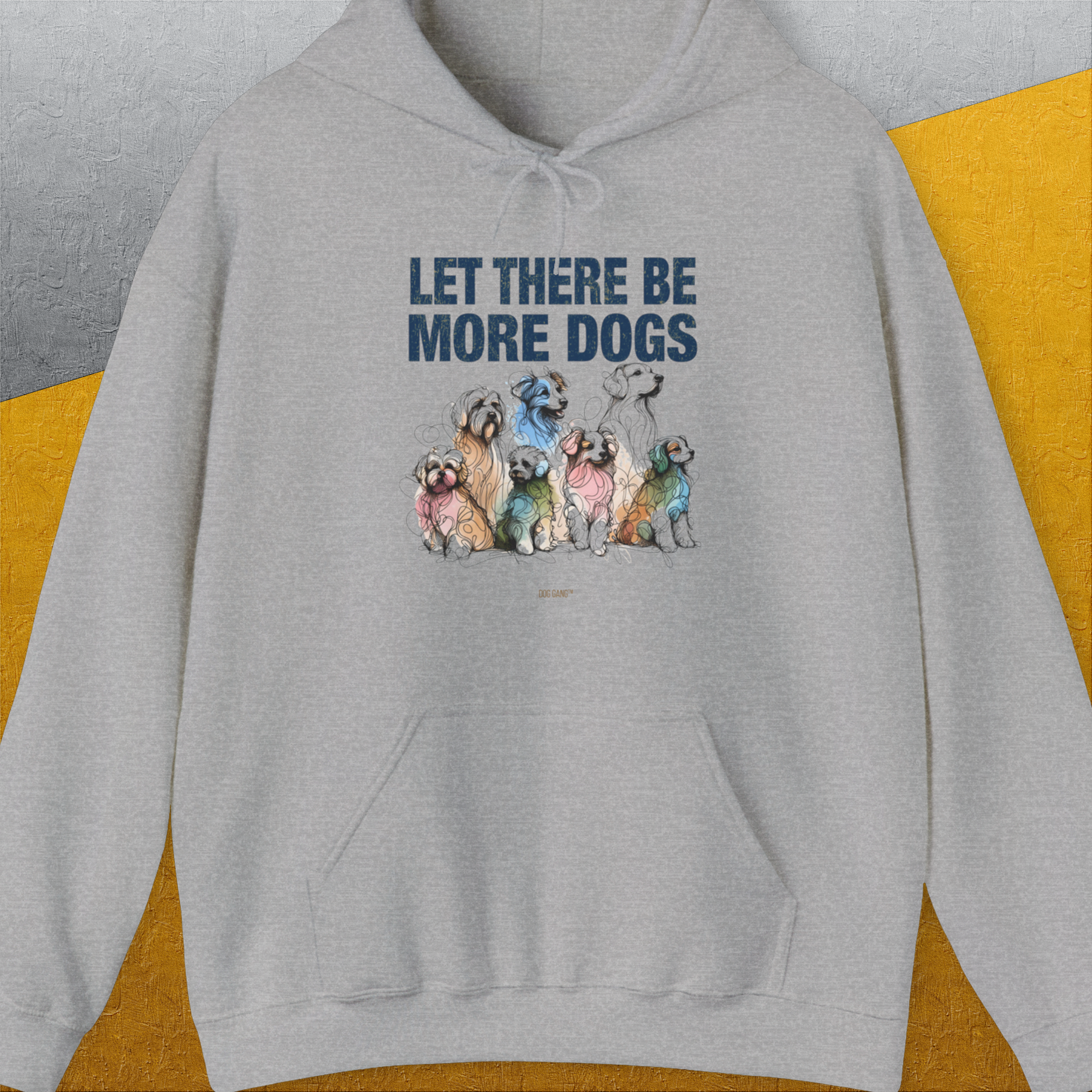The Let There Be More Dogs Unisex Hoodie features colorful dog illustrations and the text LET THERE BE MORE DOGS, making it a perfect dog lover gift. Designed by Dog Gang.