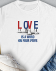 Love Is A Word On Four Paws, Volume 1 white womens tee features a cute dog paw design with the phrase LOVE is a word on four paws. Perfect gift for any dog lover. Designed by Dog Gang.