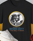 Black unisex T-shirt, Member Of The Watchdog Society Series, Volume 3, with a dog peering over a fence. Perfect for any dog lover. Designed by Dog Gang.