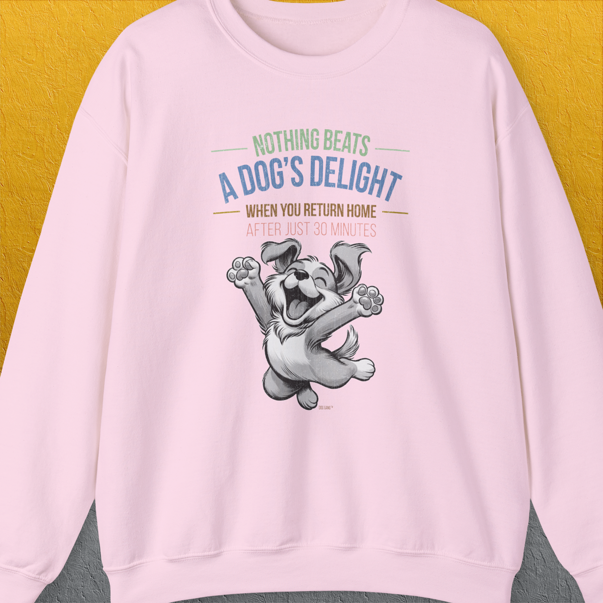 Light Pink sweatshirt with a joyful jumping very happy cute dog illustration and the saying Nothing Beats A Dogs Delight When You Return Home (after just 30 minutes), Volume 1. Perfect for any dog lover. Designed by Dog Gang.