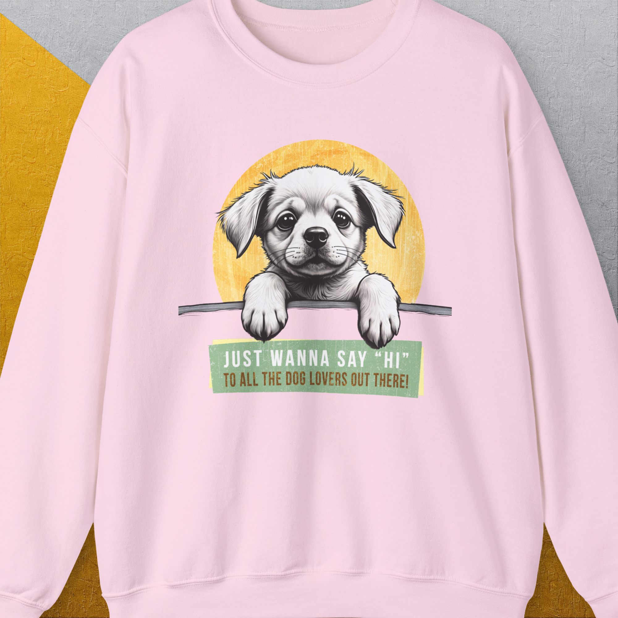 The light pink Say Hi sweatshirt showcases a cute dog design with the phrase, Just wanna say Hi to all the dog lovers out there! Perfect for any dog owner. Designed by Dog Gang.