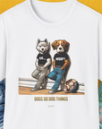 The So... Woof? Volume 6 Unisex T-Shirt showcases illustrated dogs in shirts with SO... and WOOF? text beside a soccer ball, saying DOGS DO DOG THINGS. Designed by Dog Gang.