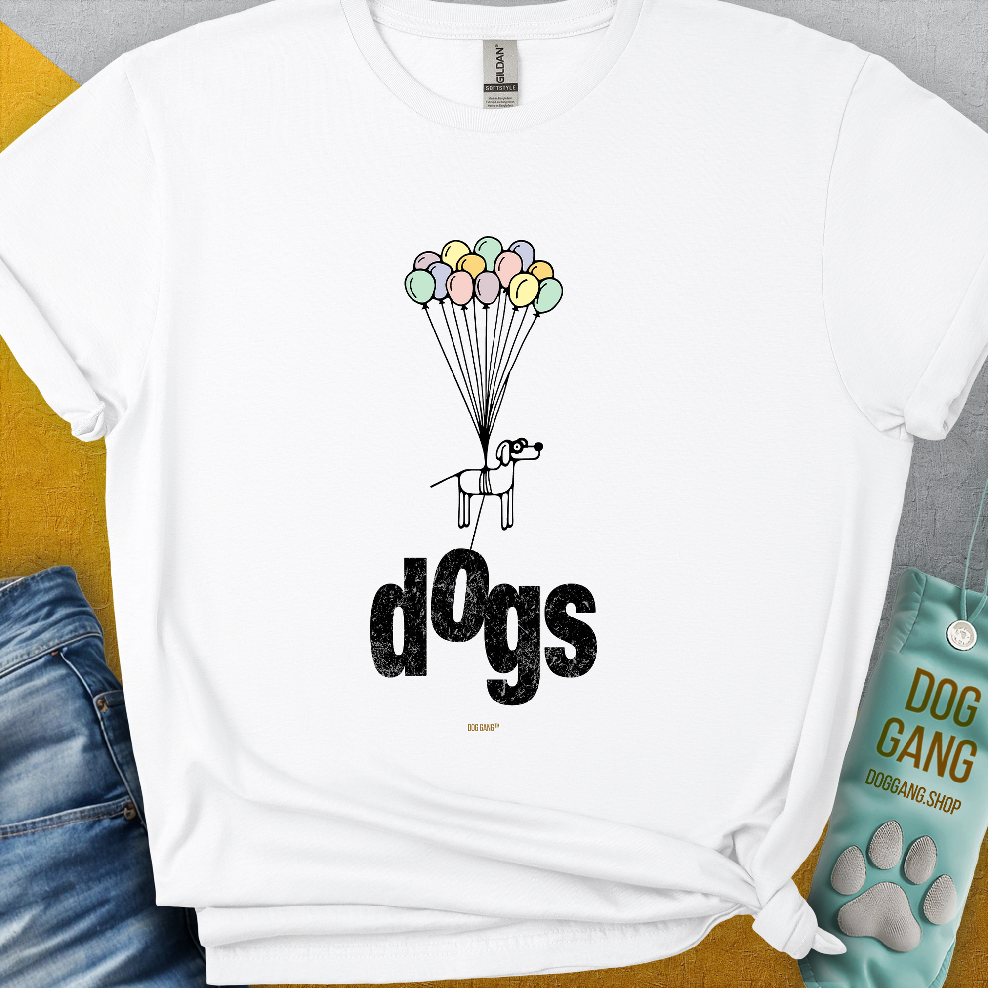 Unisex white tee with a playful dog illustration and colorful balloons above dogs. Perfect funny shirt for pet lovers. 100% soft-style cotton. Designed by Dog Gang.