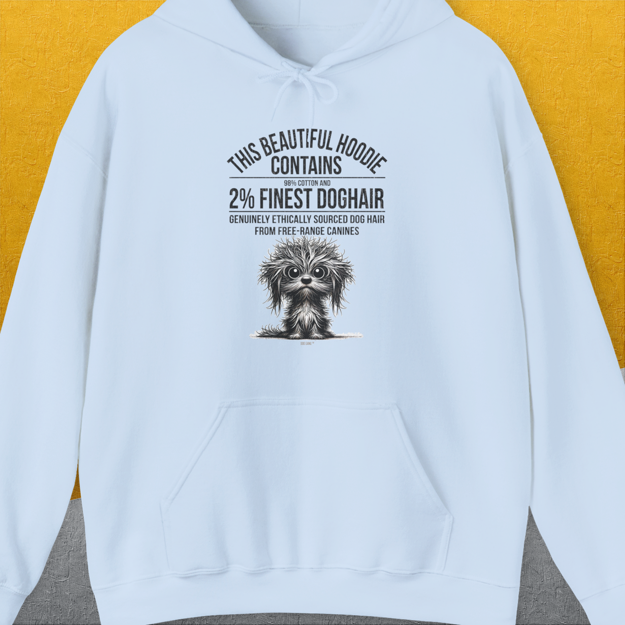 A white unisex shirt from the This Beautiful Hoodie Contains Finest Dog Hair, Volume 3 collection features a playful design. Crafted from ethically sourced US cotton, it highlights a small dog illustration alongside witty text about gathering dog hair from free-range canines. Shirtdesign by Dog Gang ensures style and comfort for all wearers.