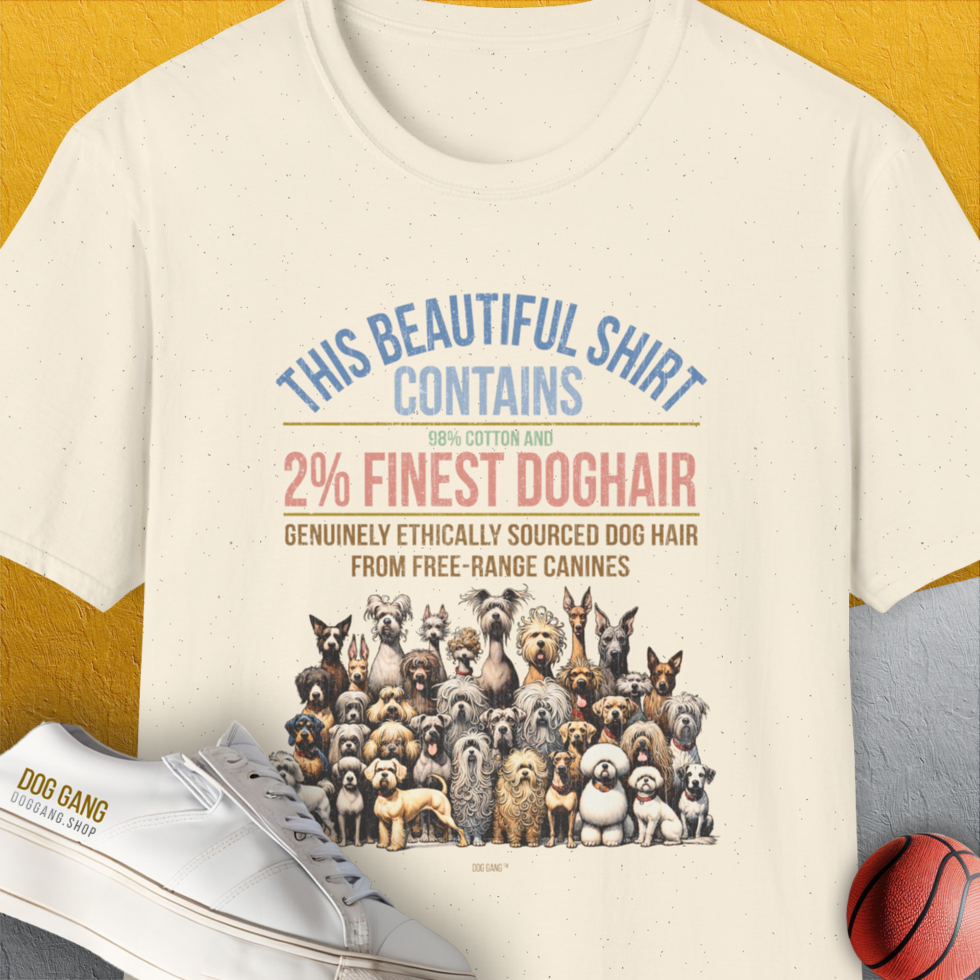 The This Beautiful Shirt Contains Finest Dog Hair, Volume 6 natural t-shirt highlights a playful dog-themed design with a humorous message about containing 2% dog hair. Designed by Dog Gang.