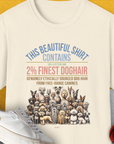 The This Beautiful Shirt Contains Finest Dog Hair, Volume 6 natural t-shirt highlights a playful dog-themed design with a humorous message about containing 2% dog hair. Designed by Dog Gang.