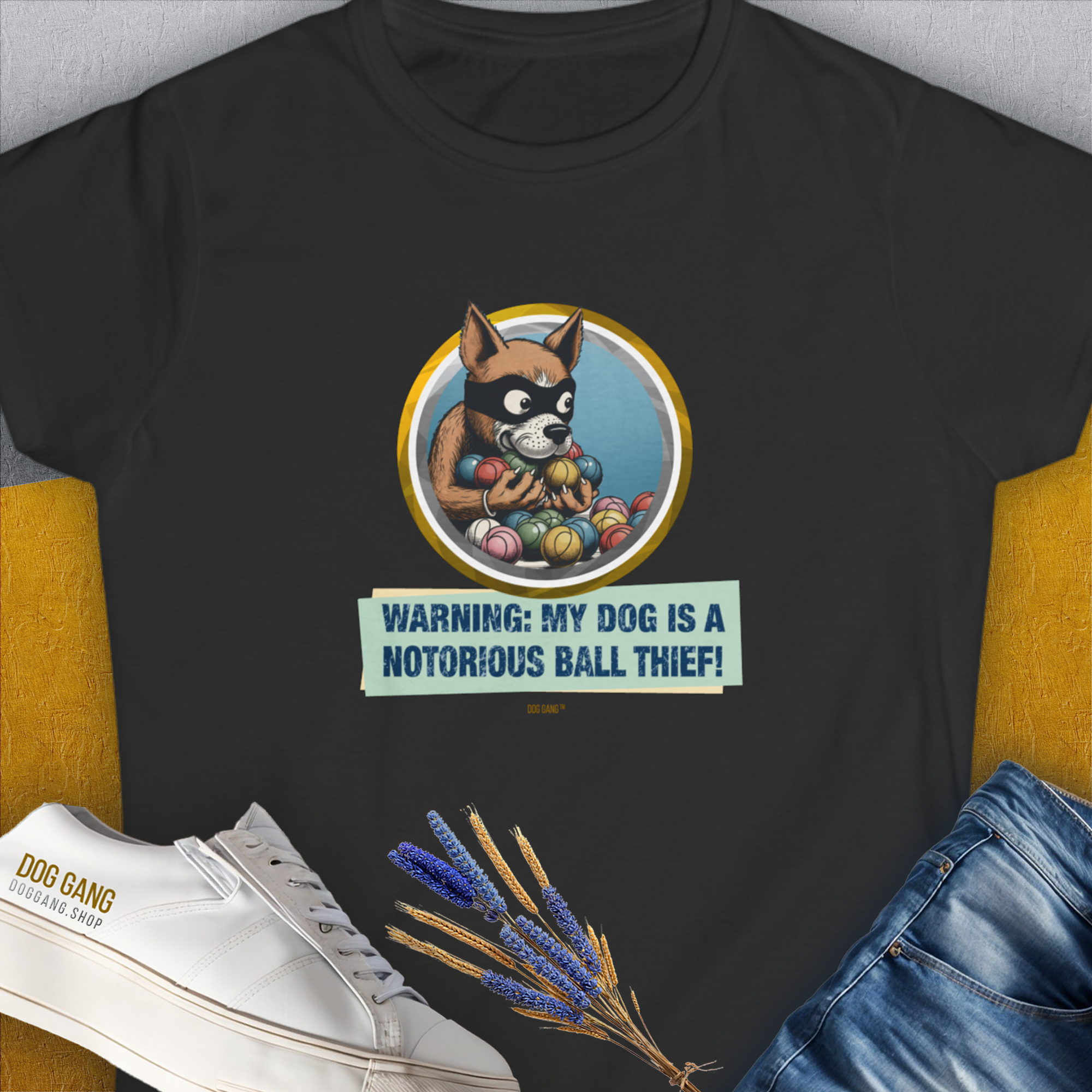 The Warning: My Dog Is A Notorious Ball Thief, Volume 1 black T-shirt showcases a cute dog design with a masked cartoon dog surrounded by balls. Ideal for any dog lover. Designed by Dog Gang.