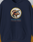 Navy unisex hoodie with a vintage design featuring a dog in aviator sunglasses looking into the distance, and the quote Serious About Our Mission. Funny dog shirt crafted from an ethically grown cotton-polyester blend. Designed by Dog Gang.