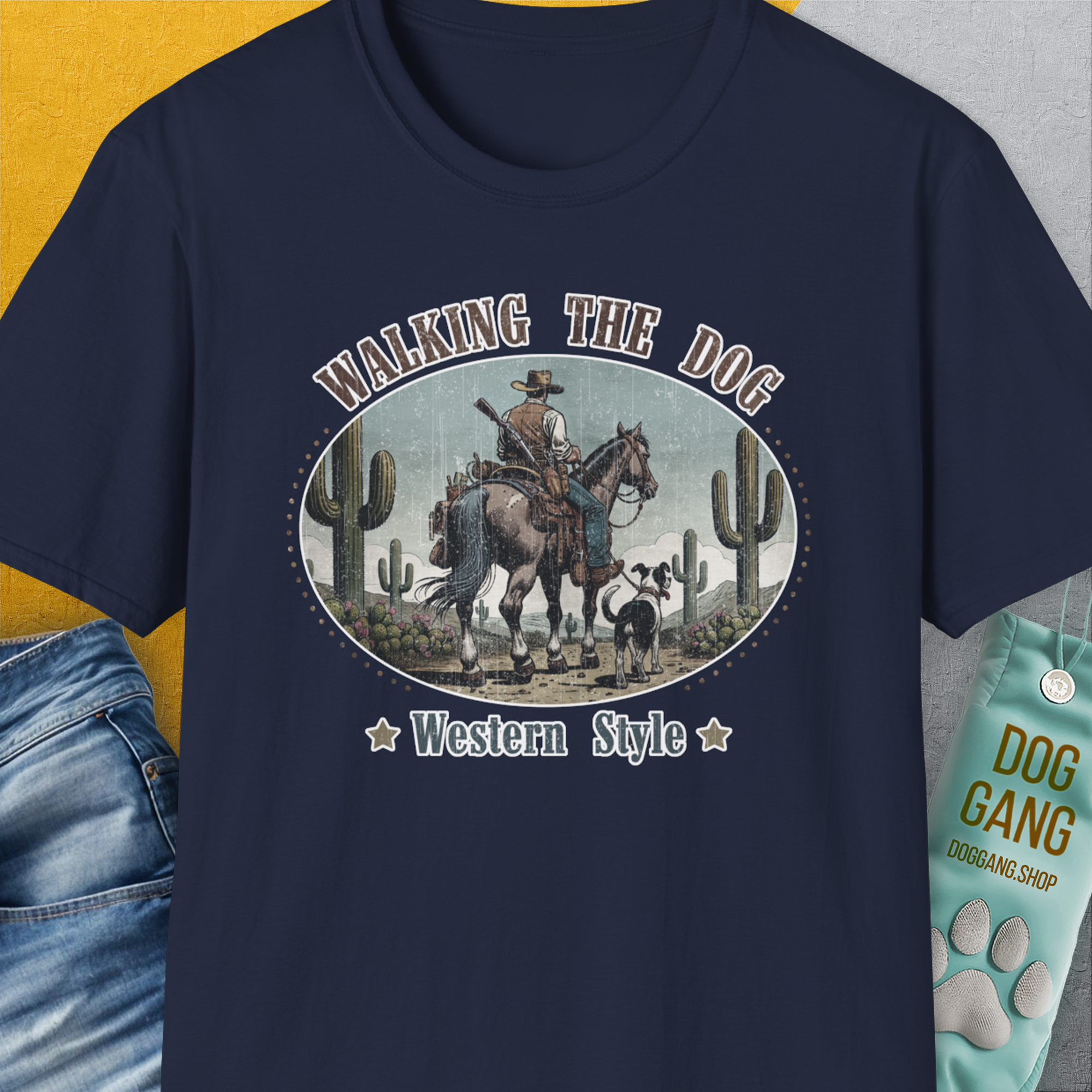 This navy tee features a funny cowboy and dog design, ideal for any dog lover. Designed by Dog Gang.